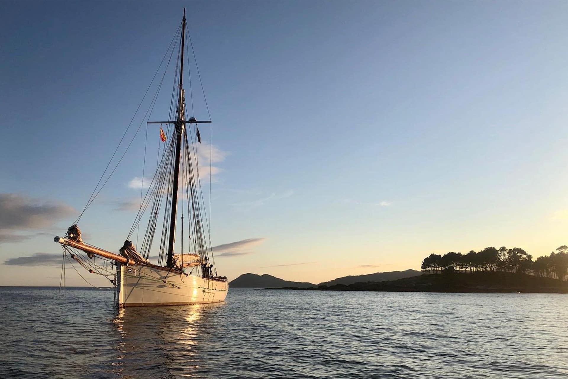 Pellew pilot cutter anchored in sunshine Europe France