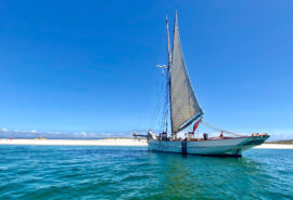 Pellew pilot cutter at beach blue sky