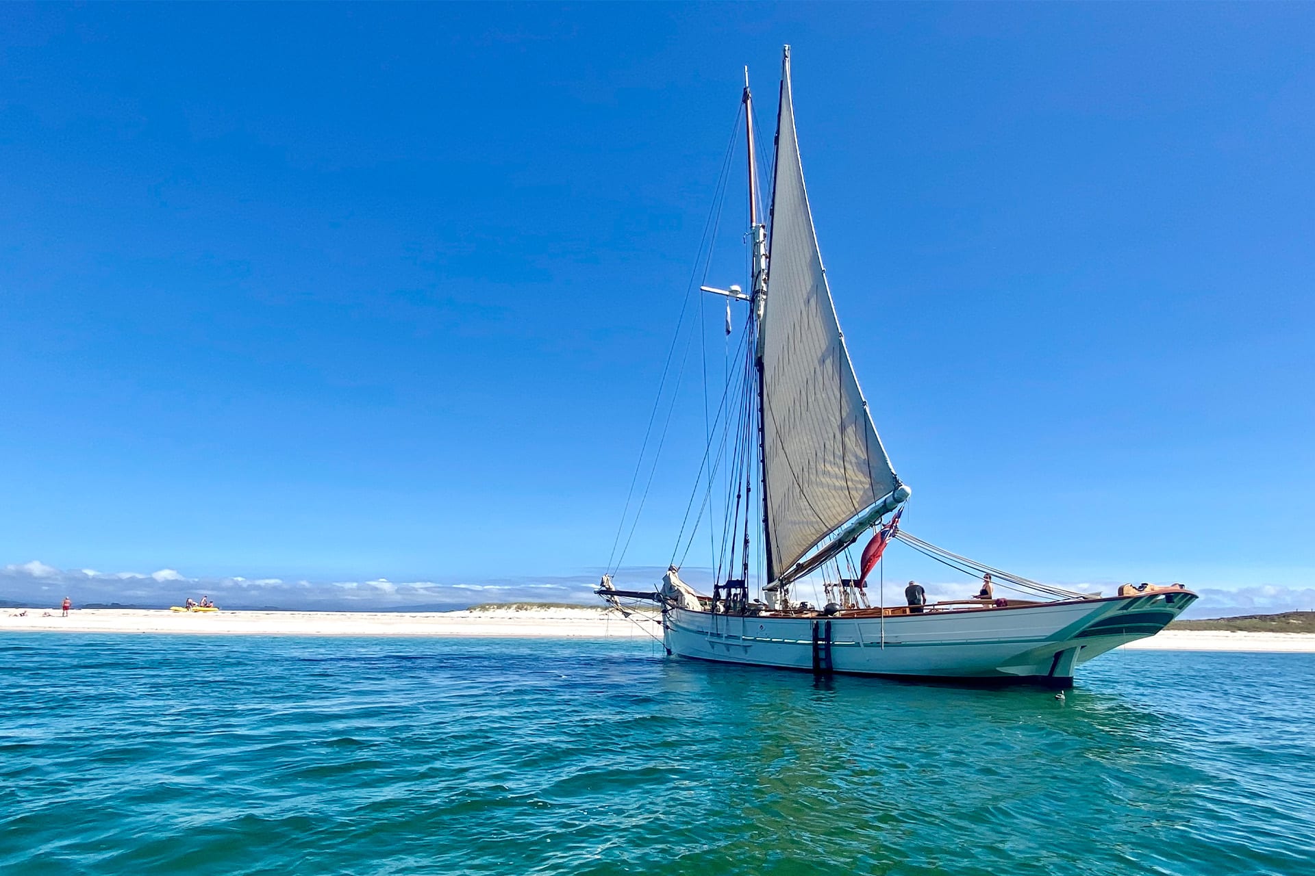Pellew pilot cutter at beach blue sky