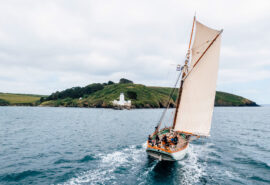 Pellew pilot cutter from stern sailing in Cornwall