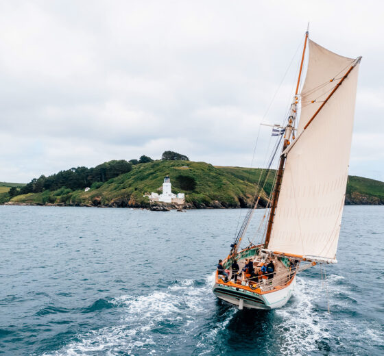 Pellew pilot cutter from stern sailing in Cornwall