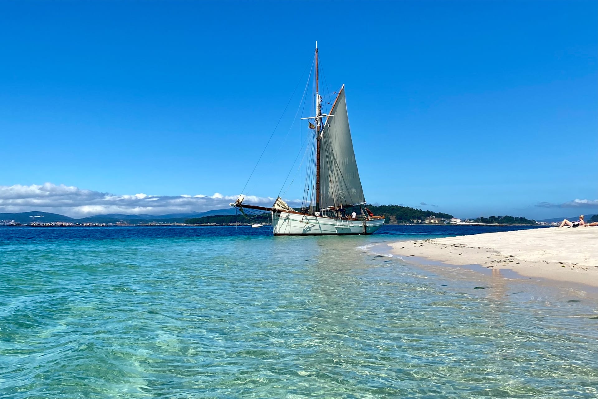 Pellew pilot cutter on beach sunny Isles of Scilly France