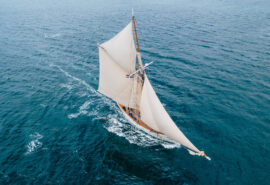 Pellew pilot cutter underway from above in open ocean