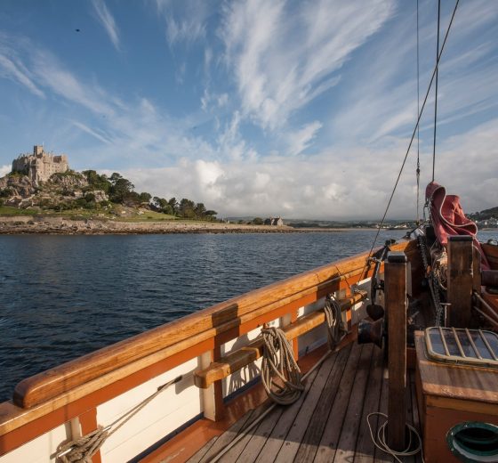 Pilgrim of Brixham sailing by St. Michael's Mount, Cornwall - Sailing Holidays in Devon and Cornwall