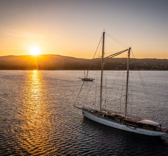 Rhea anchored at sunset classic yacht