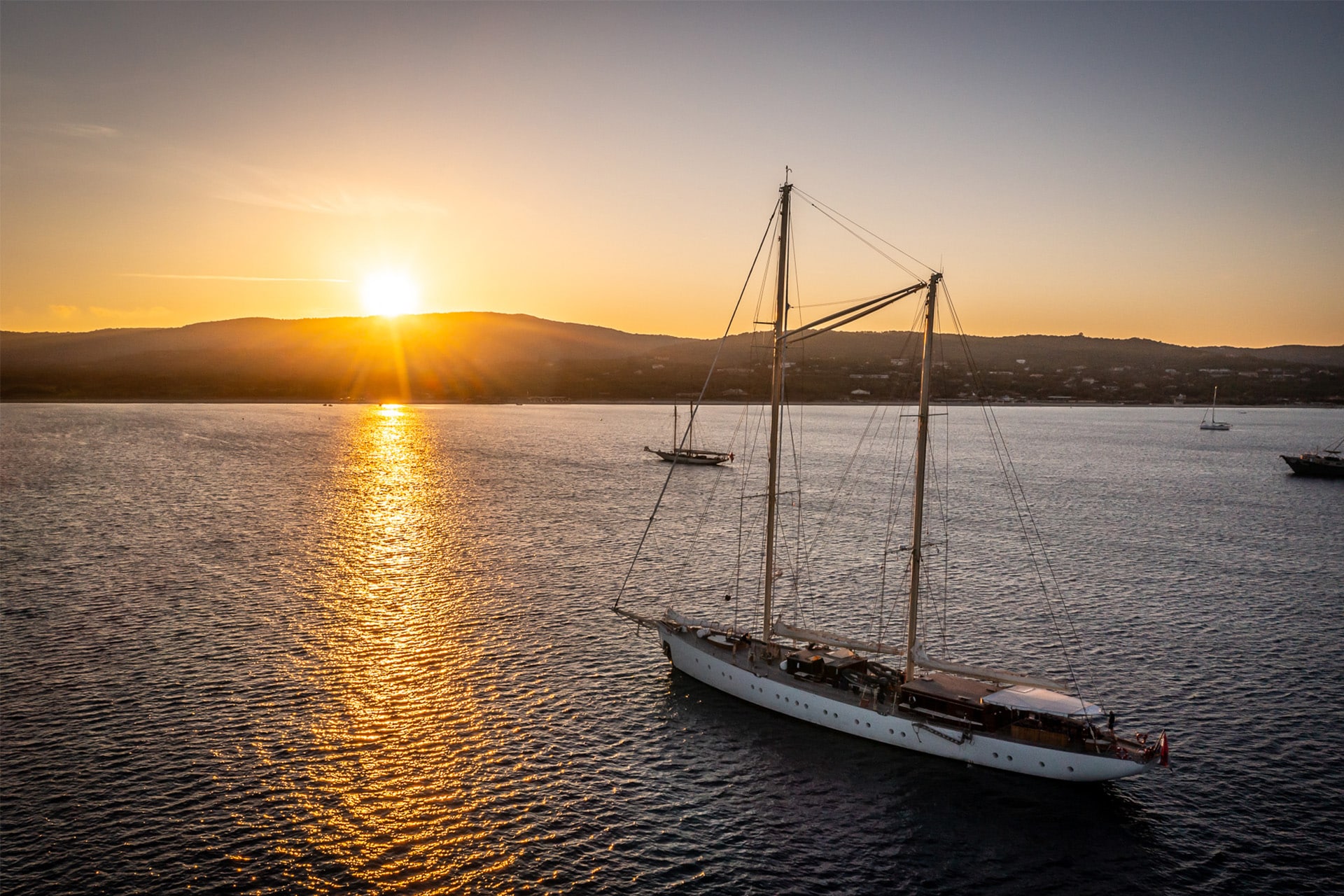Rhea anchored at sunset classic yacht