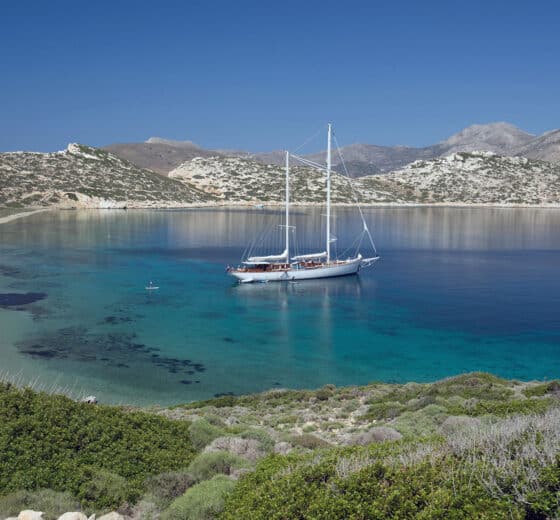 Rhea classic yacht anchored in the Cyclades, Greece, Mediterranean