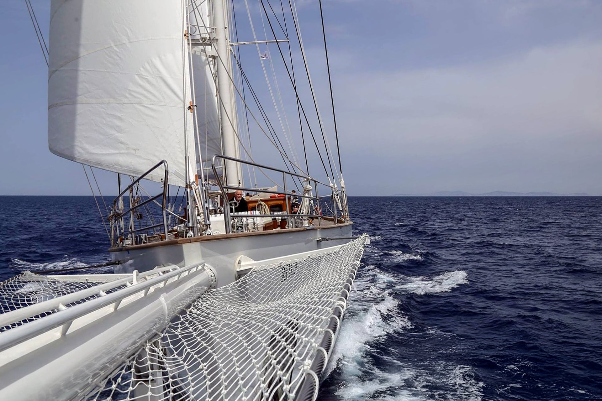 Rhea classic yacht sailing underway offshore from bow
