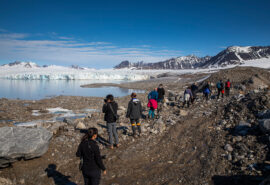 Sail Norway Goxsheim Valiente guests hiking ashore in Svalbard fjord arctic circle norway