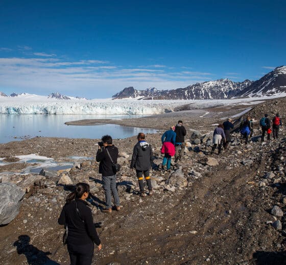 Sail Norway Goxsheim Valiente guests hiking ashore in Svalbard fjord arctic circle norway