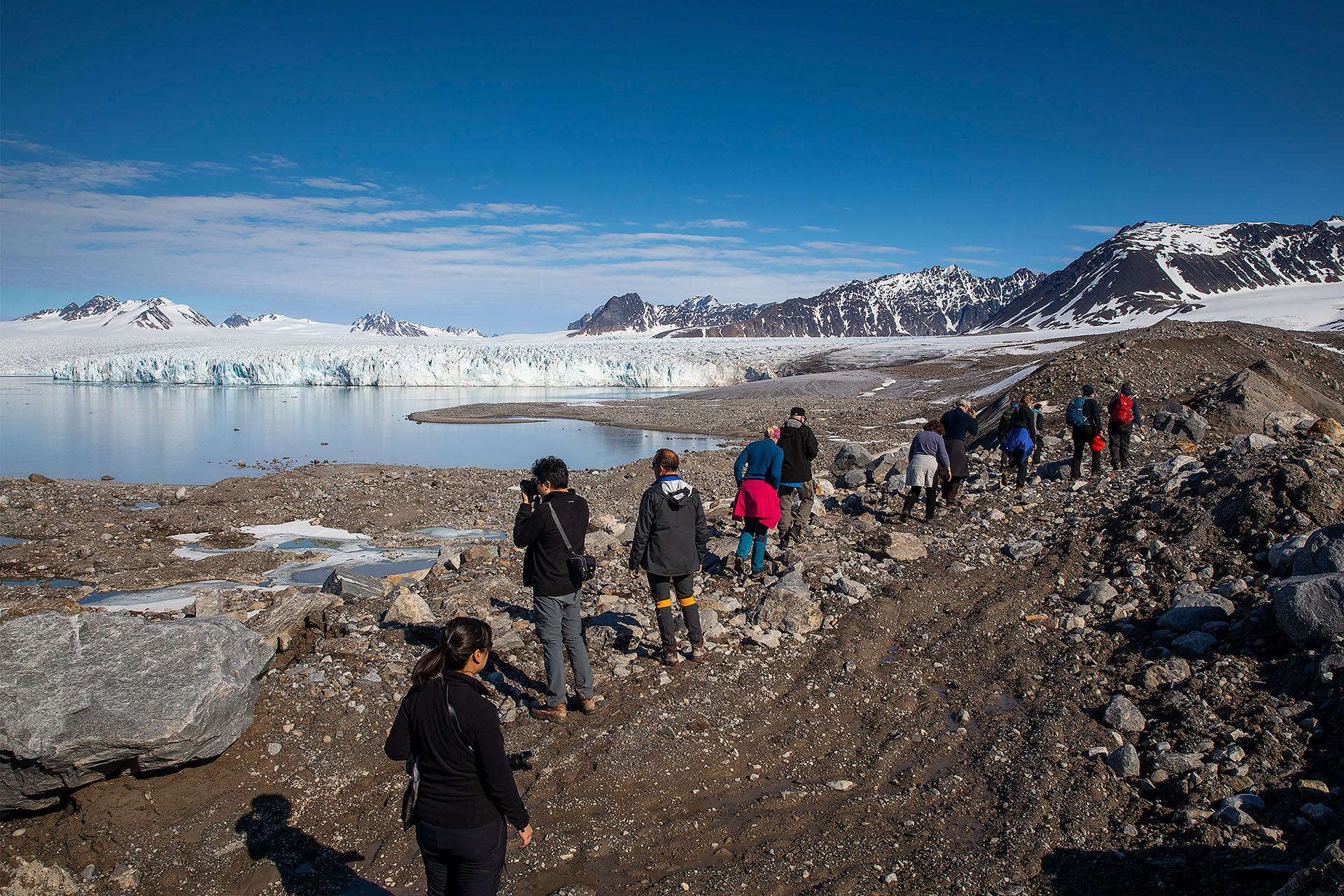 Sail Norway Goxsheim Valiente guests hiking ashore in Svalbard fjord arctic circle norway
