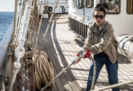 Santa Maria Manuela guest onboard pulling ropes