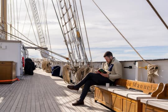 Santa Maria Manuela guest onboard reading book relaxing