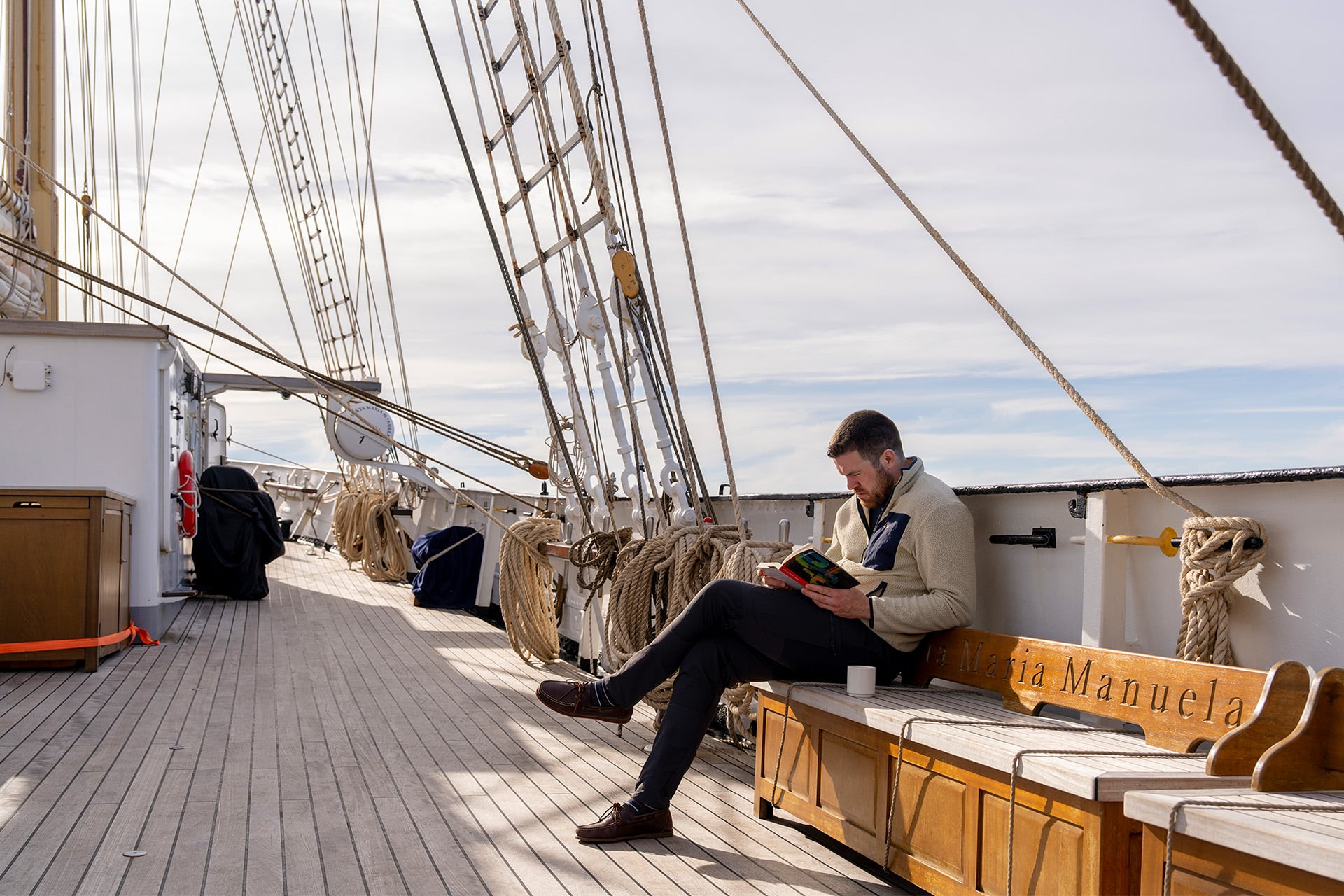 Santa Maria Manuela guest onboard reading book relaxing