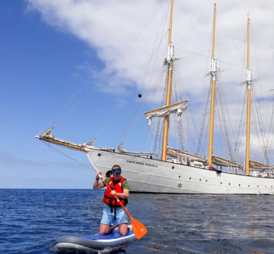Santa Maria Manuela guest paddleboarding tall ship