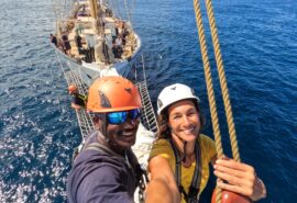 Santa Maria Manuela guests on bowsprit tall ship