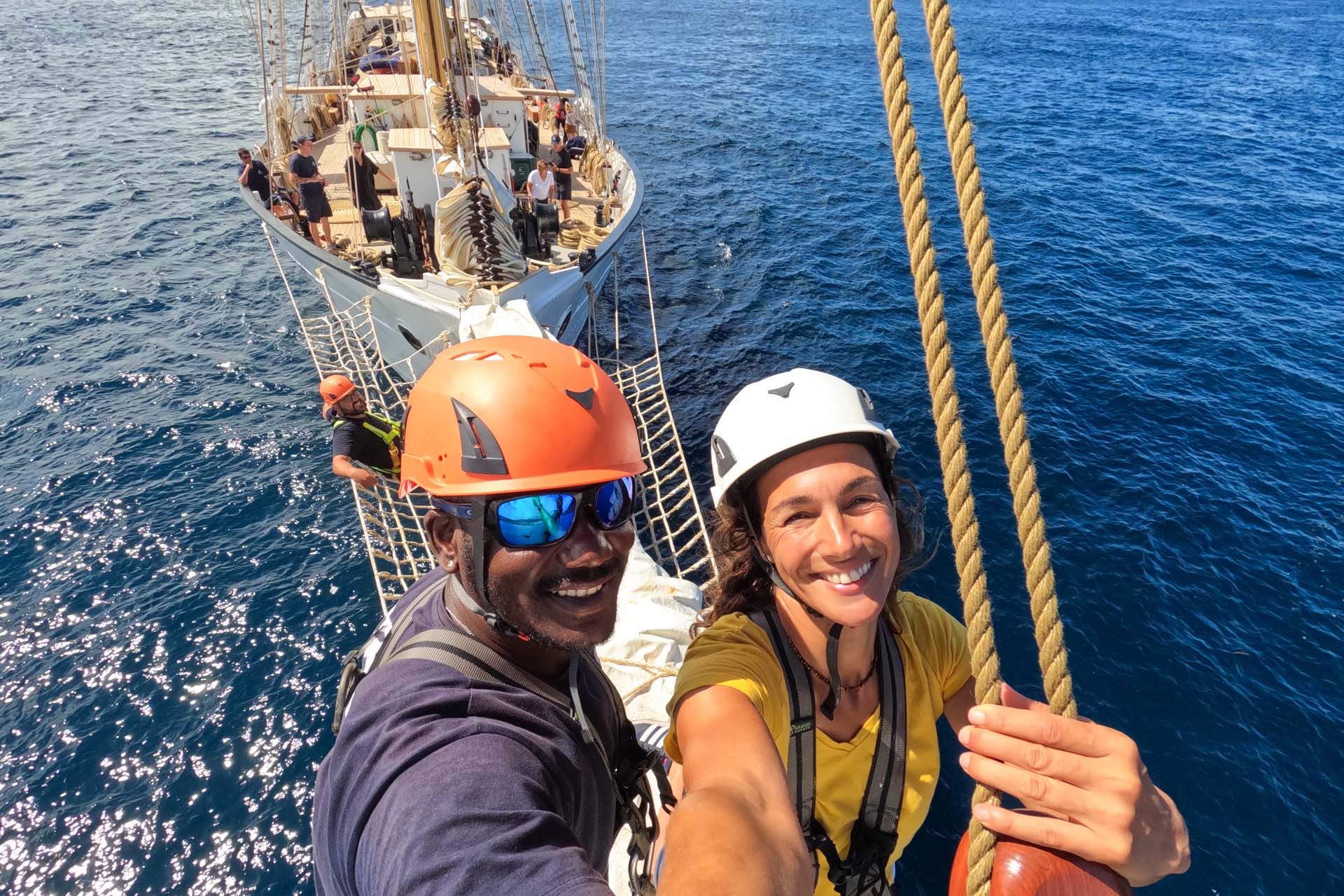 Santa Maria Manuela guests on bowsprit tall ship