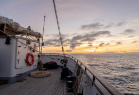 Santa Maria Manuela onboard on deck at sunset sailing