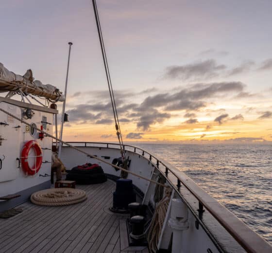 Santa Maria Manuela onboard on deck at sunset sailing