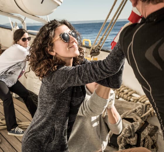 Santa maria manuela guests onboard pulling ropes tall ship