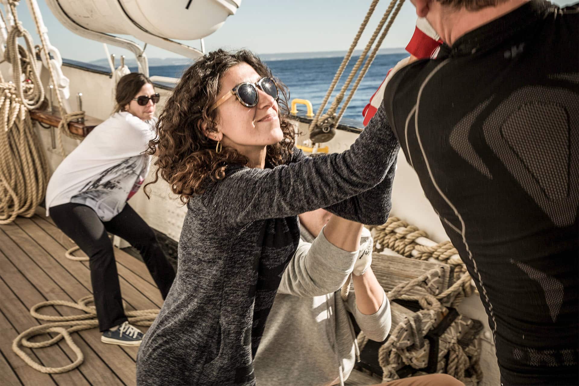 Santa maria manuela guests onboard pulling ropes tall ship