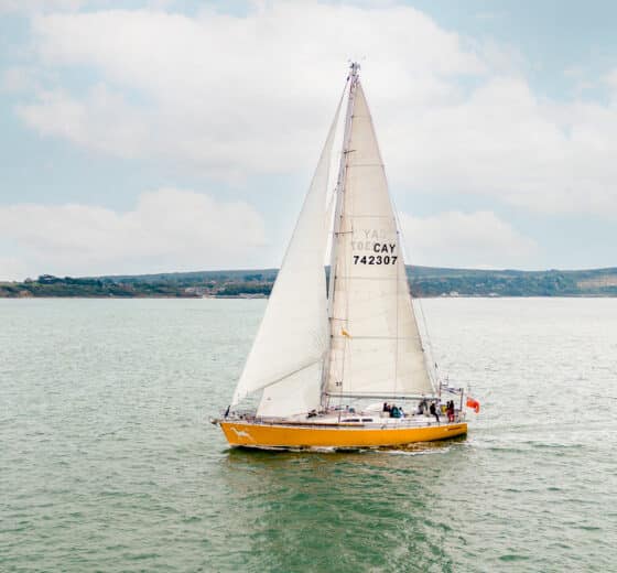 Sea Dragon yacht underway sailing off coastline adventure yacht