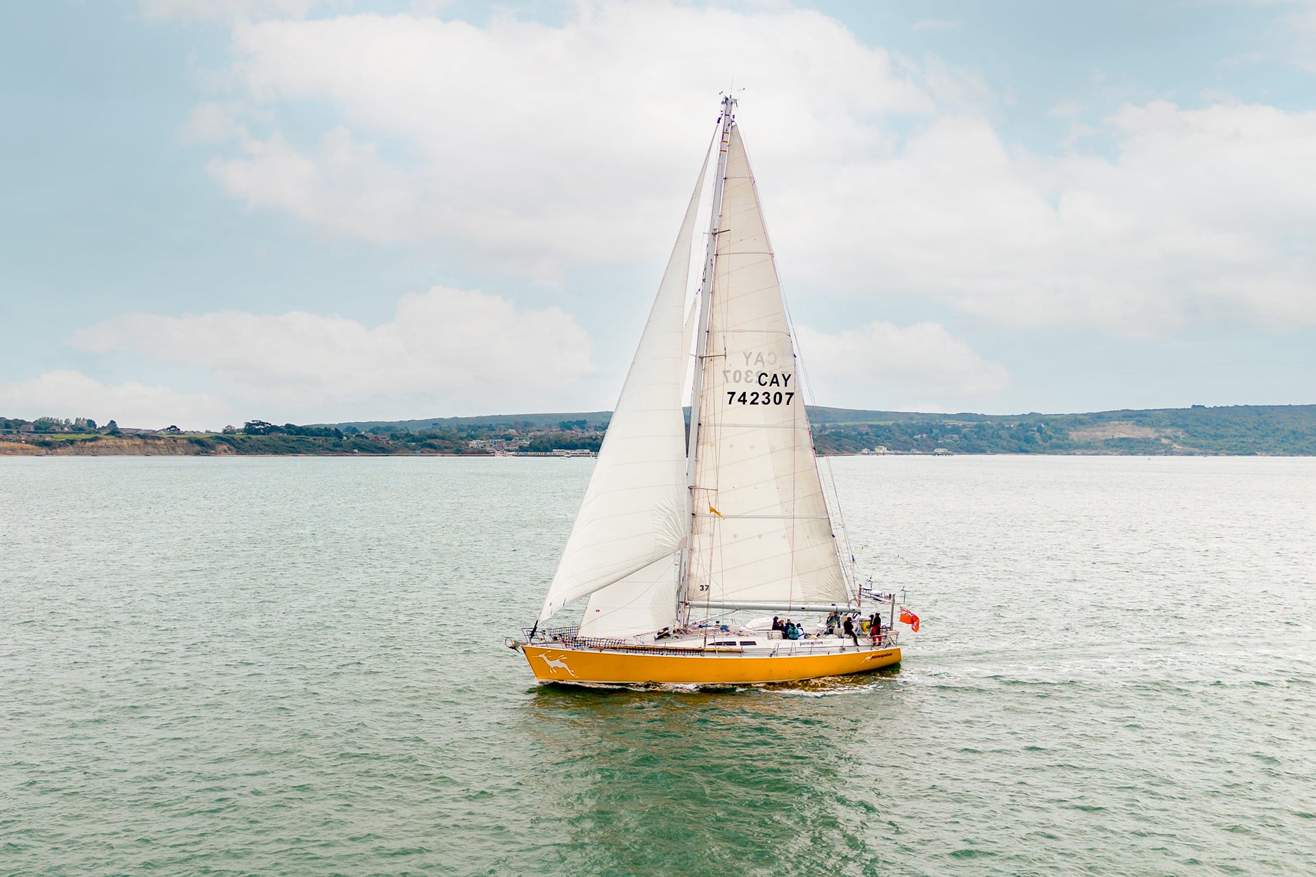 Sea Dragon yacht underway sailing off coastline adventure yacht