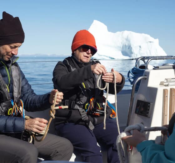 Sea dragon guests on deck learning knots in Arctic, greenland