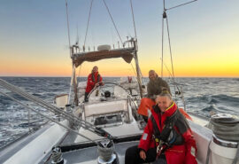 Sea dragon guests onoard adventure sailing at sunset open ocean -
