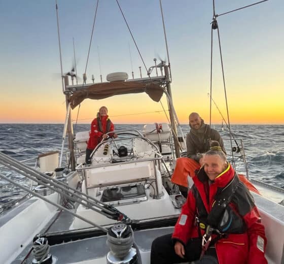 Sea dragon guests onoard adventure sailing at sunset open ocean -