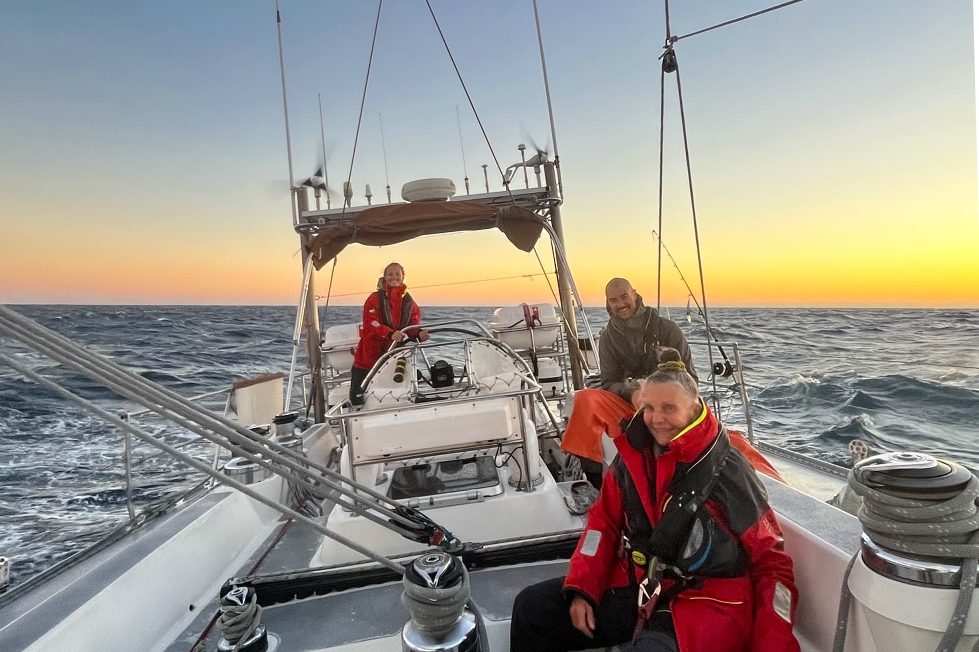 Sea dragon guests onoard adventure sailing at sunset open ocean -