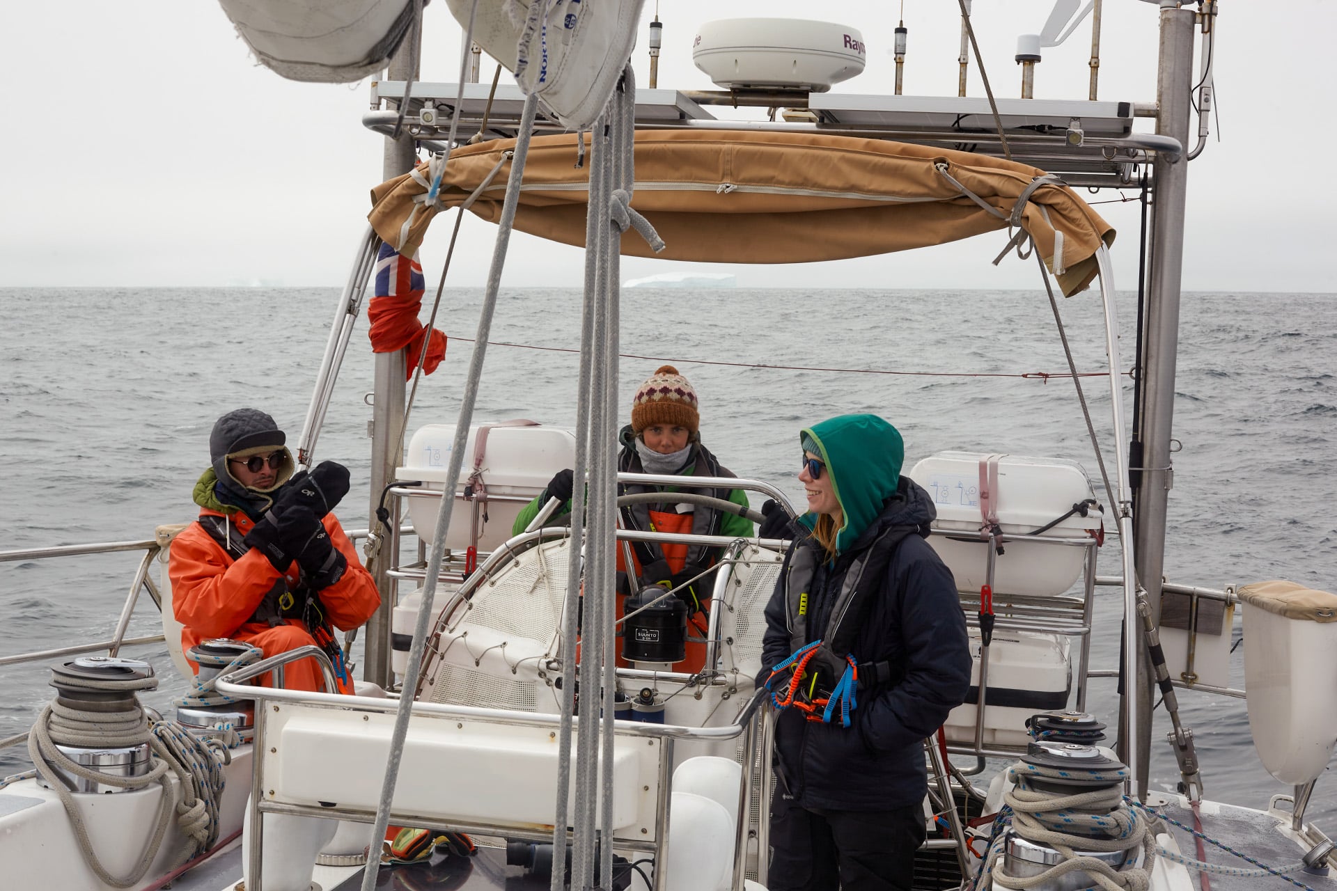 Sea dragon sailing yacht guests onboard at helm underway -