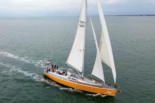 Sea dragon sailing yacht underway from side full sail adventure -