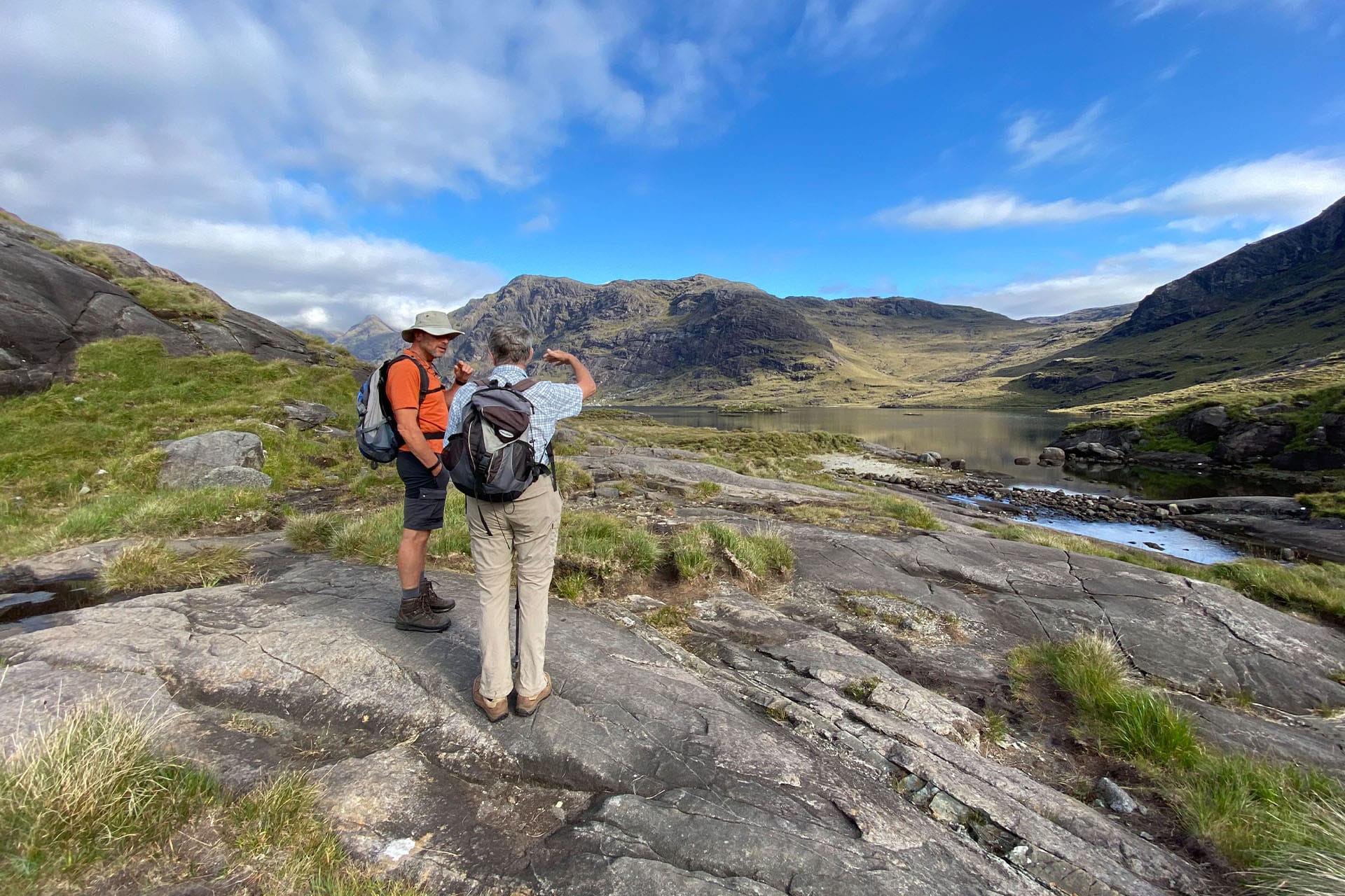 Steady guests hiking ashore Loch Coruisk, Isle of Skye, walking Scotland