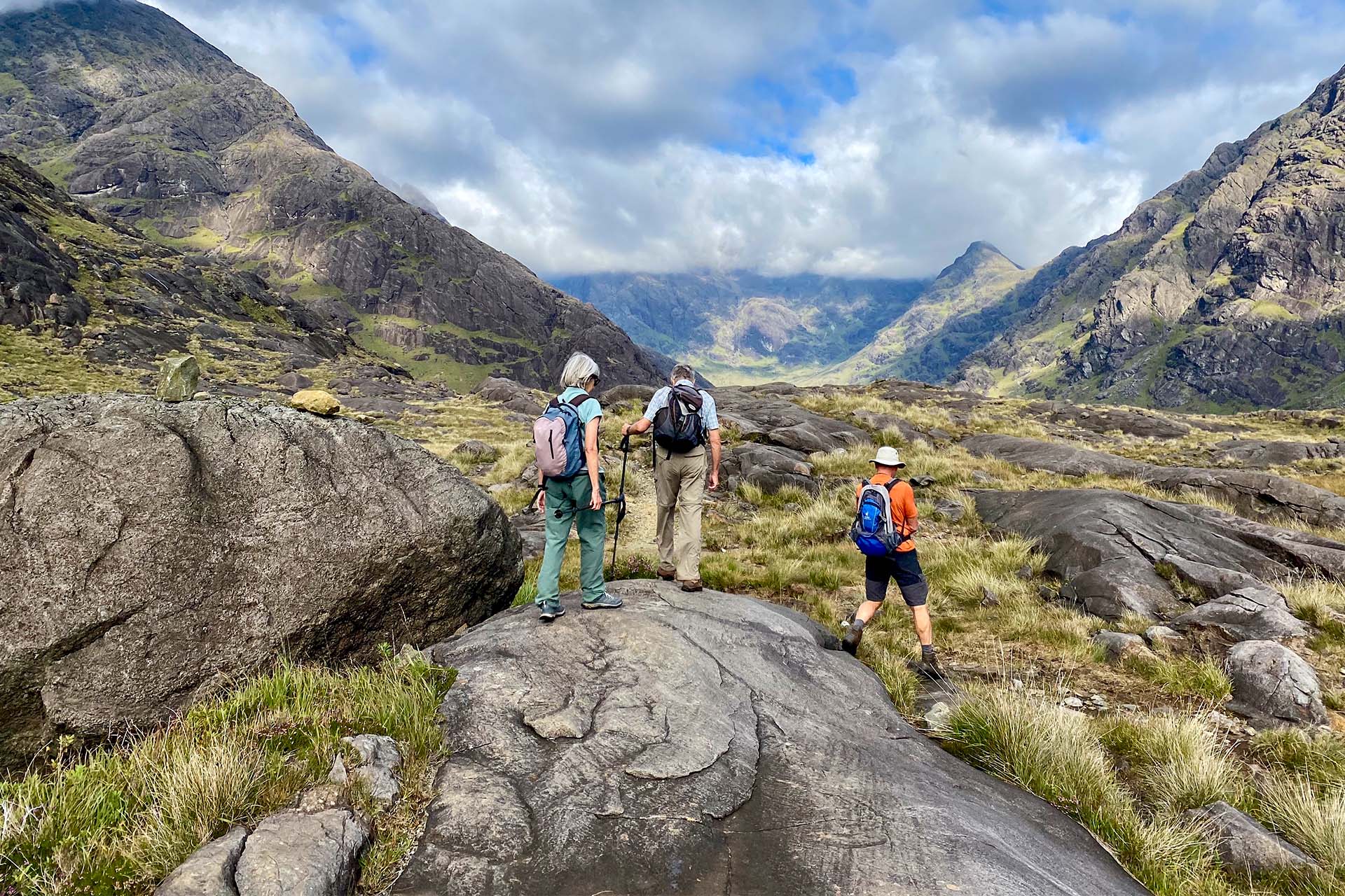Steady guests walking ashore Isle of Skye, Hebrides hiking Scotland