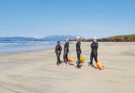 Stravaigin guests on a beach