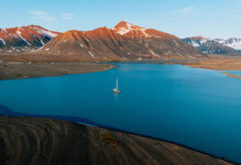 Svalbard summer landscape with Valiente anchored
