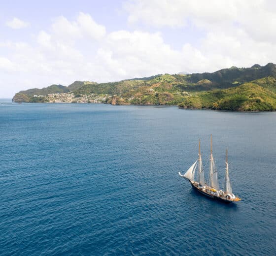 Tall ship Blue Clipper sailing off the coast of St Vincent, Caribbean
