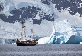 Tecla anchored with iceberg Portal Point Antarctica