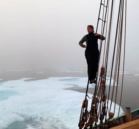 Tecla guest looking out over ice in Northwest Passage