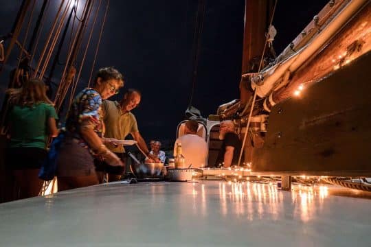 Tecla guests enjoying dinner on deck