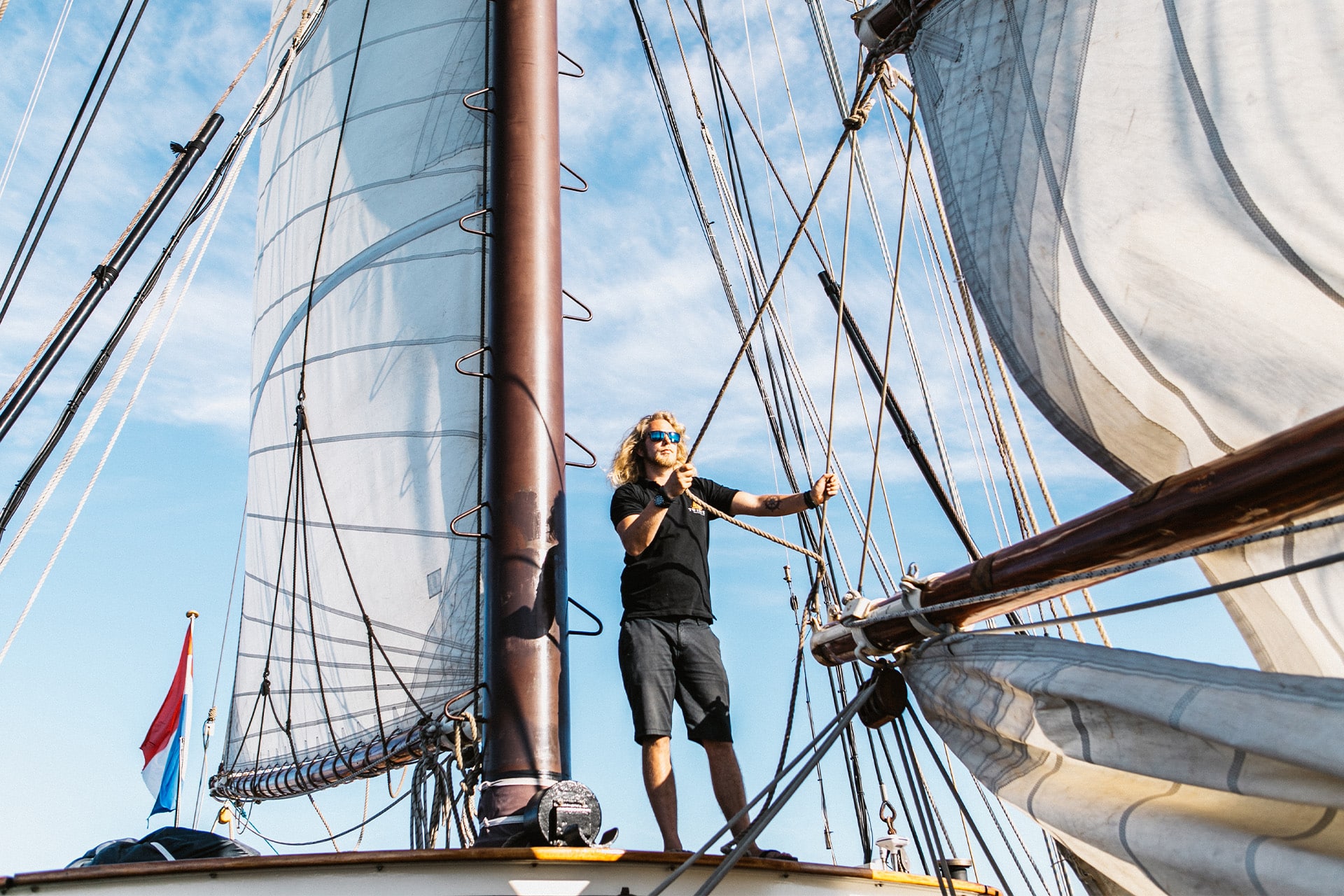 Twister crew on deck raising sails adventure sailing