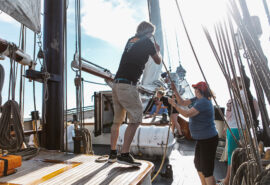 Twister guests onboard pulling ropes on deck adventure sailing