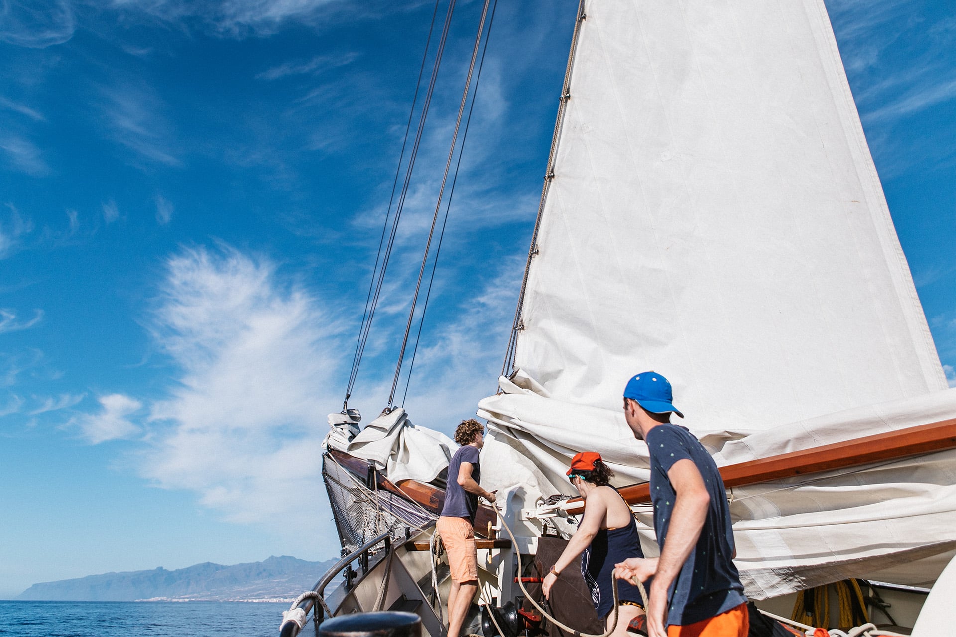 Twister guests onboard pulling ropes sailing