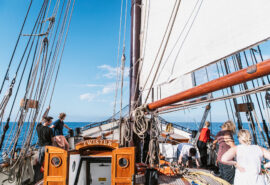 Title Twister view on deck of schooner underway sailing with guests Caption
