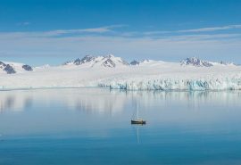 Valiente anchored in open fjord in Arctic Svalbard