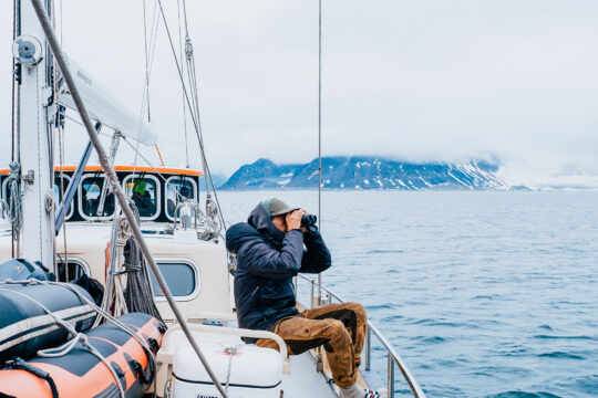 Valiente guest onboard watching for wildlife Svalbard Arctic
