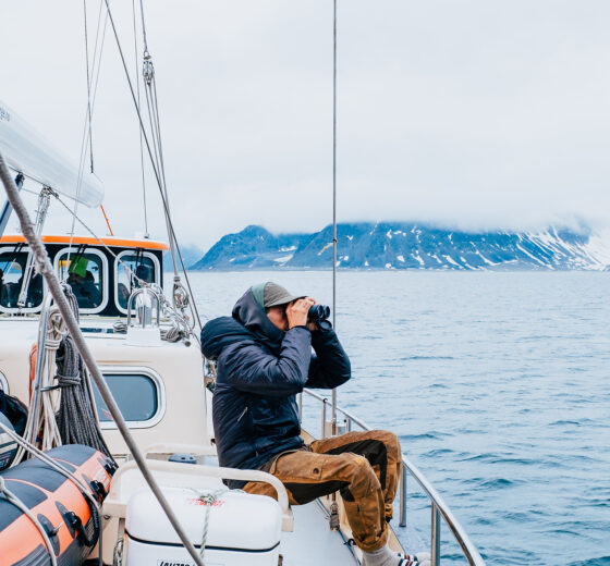 Valiente guest onboard watching for wildlife Svalbard Arctic