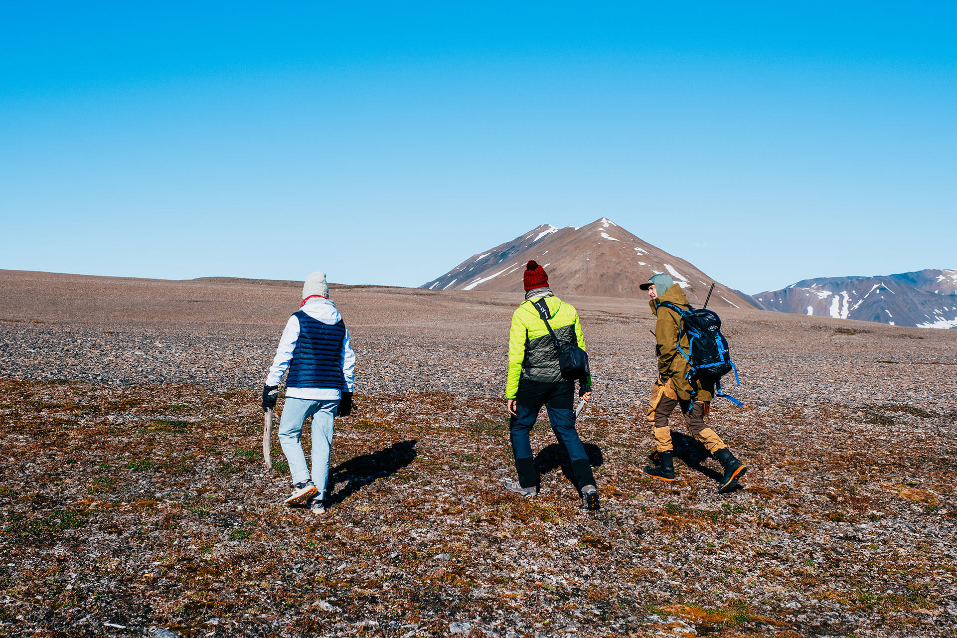 Valiente guests and guide hiking ashore in Arctic summer Svalbard