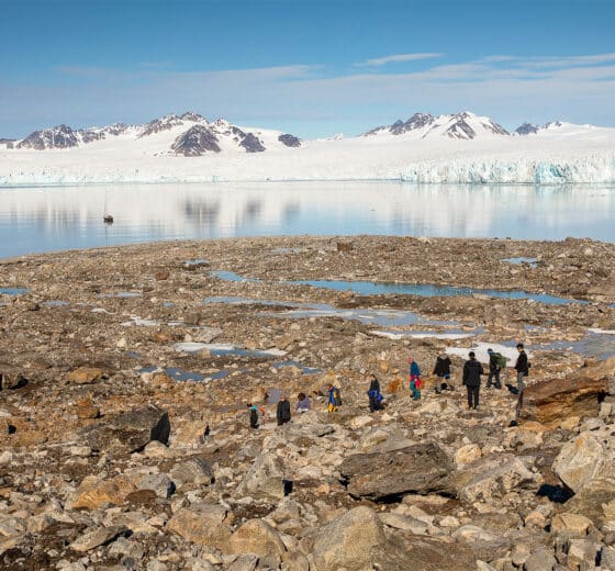 Valiente guests ashore hiking in Arctic Circle Svalbard anchored Norway